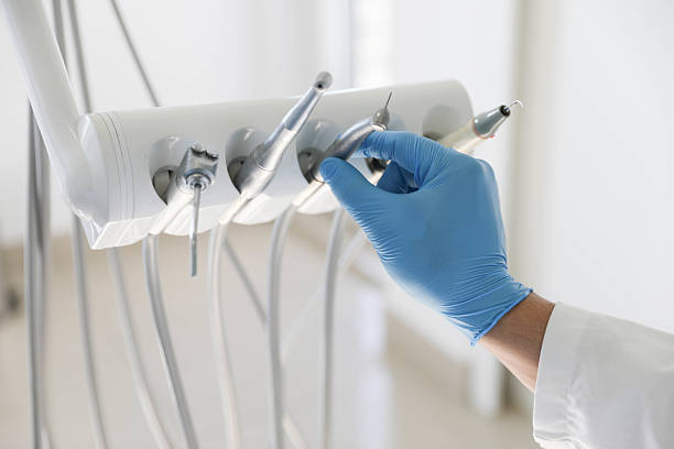 Professional Tooth Extraction technician working in Chelsea, MI